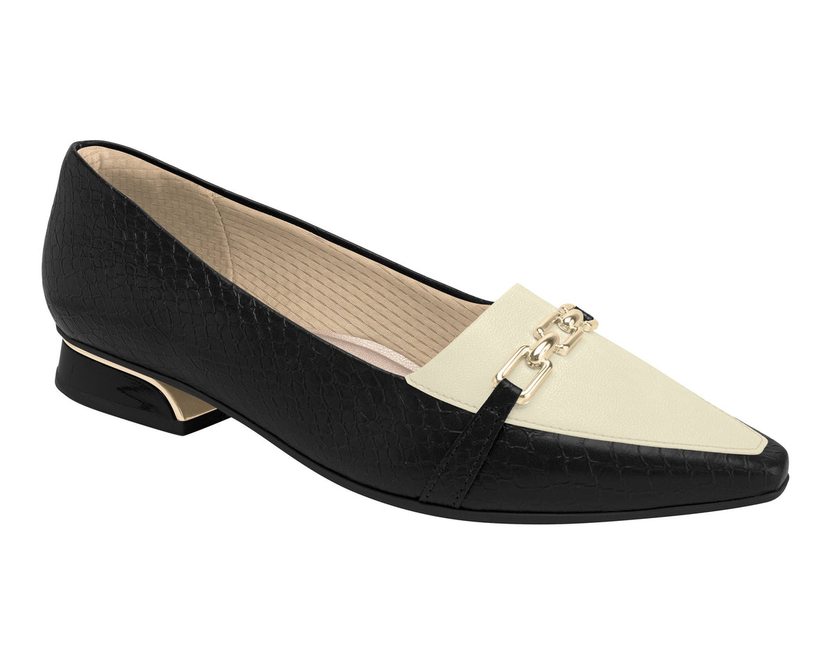 A white and black flat shoe with a moccasin-inspired design, featuring a subtle heel and gold accents, on a white background.