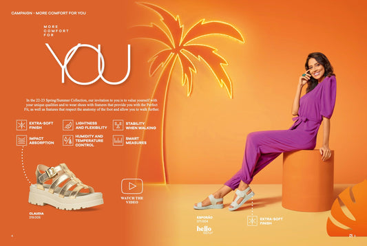 A woman in a purple jumpsuit smiles on an orange cylinder by a palm tree graphic. On the left, Piccadilly Ref: 219005 Fisherman Sandals from the 22-23 Spring/Summer Collection highlight comfort features like Perfect Fit Gold and Extra-Soft Finish.